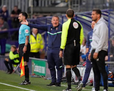Micky Mellon Manager of Tranmere Rovers appeals to Fourth Official Martin Woods