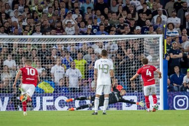 Callum Styles #4 of Barnsley takes the penalty but is saved by Illan Meslier #1 of Leeds United during the first half 