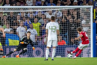 Callum Styles #4 of Barnsley takes the penalty but is saved by Illan Meslier #1 of Leeds United during the first half 