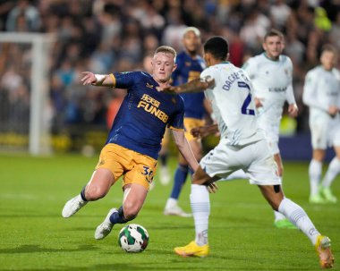 Sean Longstaff #36 of Newcastle United competes for the ball with Josh Dacres-Cogley #2 of Tranmere Rovers