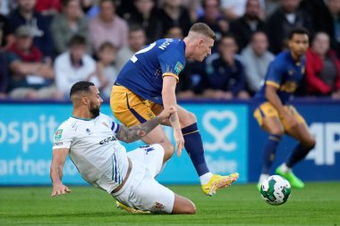 Kane Hemmings #10 of Tranmere Rovers tackles Elliot Anderson #32 of Newcastle United