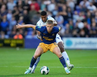 Kyle Jameson #18 of Tranmere Rovers competes for the ball with Matt Ritchie #11 of Newcastle United