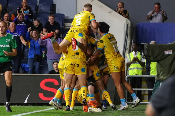 Blake Austin #6 of Leeds Rhinos celebrates his try to win the match