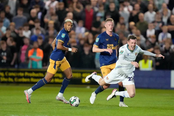 Sean Longstaff #36 of Newcastle United fouls Paul Lewis #22 of Tranmere Rovers