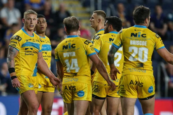 Mikolaj Oledzki #8 of Leeds Rhinos looks to the big screen after scoring a possible try