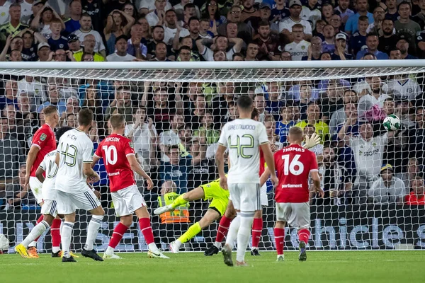 Mateusz Klich #43 of Leeds United takes a shot and scores in the second half to make it 3-1