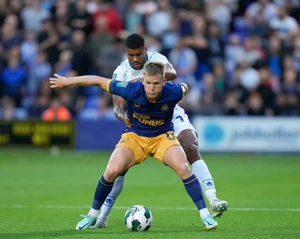 Kyle Jameson #18 of Tranmere Rovers competes for the ball with Matt Ritchie #11 of Newcastle United