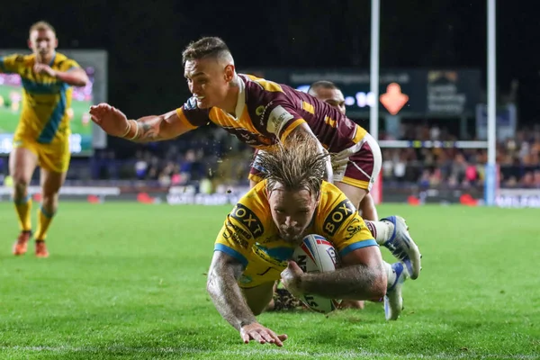 Blake Austin #6 of Leeds Rhinos goes over for the match winning try