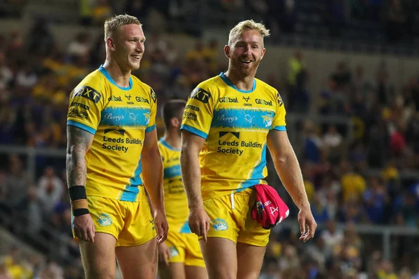 Mikolaj Oledzki #8 of Leeds Rhinos and Matt Prior #10 of Leeds Rhinos acknowledge the Leeds fans