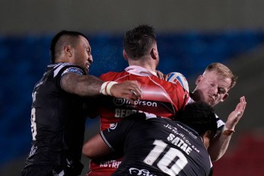 Jordan Johnstone #21 of Hull FC tackles Alex Gerrard #29 of Salford Red Devils