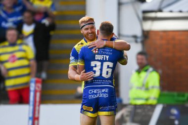 Matt Dufty #36 of Warrington Wolves celebrates his try
