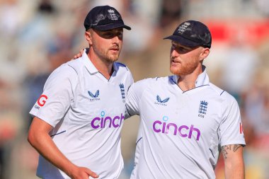 Ben Stokes of England congratulates Ollie Robinson of England on his bowling at the end of South Africas first innings 