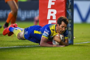 Stefan Ratchford #1 of Warrington Wolves goes over for his 100th Career try