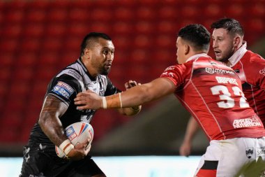 Ligi Sao #8 of Hull FC runs at Tyler Dupree #32 of Salford Red Devils