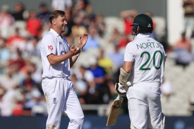 Ollie Robinson of England celebrates taking the wicket of Anrich Nortje of South Africa 