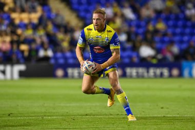 Oliver Holmes #12 of Warrington Wolves in action