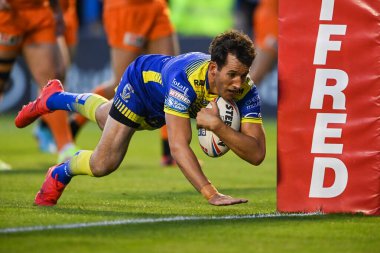 Stefan Ratchford #1 of Warrington Wolves goes over for his 100th Career try
