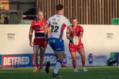 Jez Litten #14 of Hull KR puts in a kick forward 