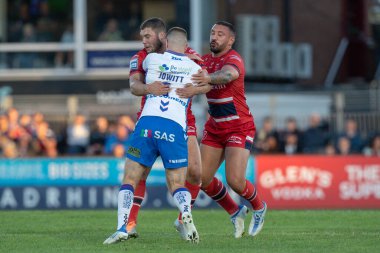 Max Jowitt #1 of Wakefield Trinity is tackled by Elliot Minchella #17 of Hull KR and Matty Storton #13 of Hull KR 
