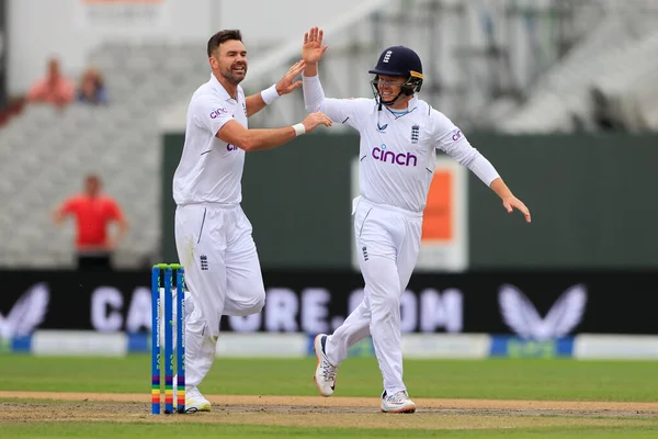 James Anderson of England celebrates with Ollie Pope of England after taking the wicket of Sarel Erwee of South Africa 