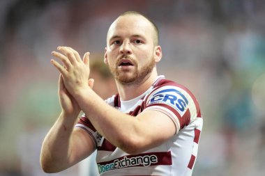 Liam Marshall #5 of Wigan Warriors salutes the fans after the match