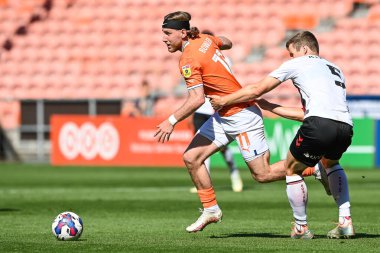 Josh Bowler #11 of Blackpool breaks past Rob Atkinson #5 of Bristol City