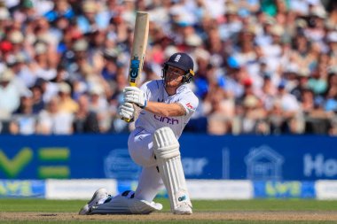 Ben Stokes of England sweeps the ball for a six