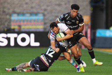 Luke Morahan of Bristol Bears tackled by Rio Dyer of Dragons Rugby,  and Jack Dixon of Dragons Rugby, 