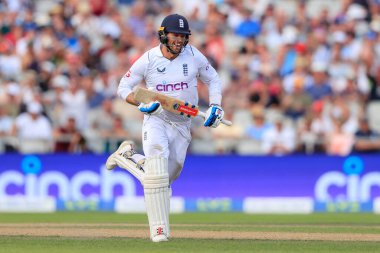 Ben Foakes of England breaks into a smile as he makes his century run