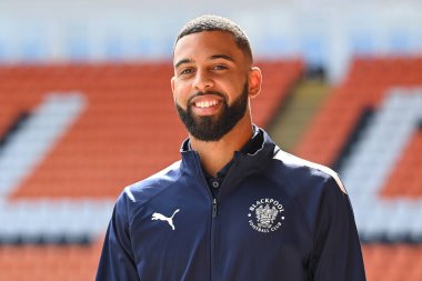 CJ Hamilton #22 of Blackpool arrives at Bloomfield Road