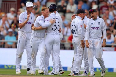 Ben Stokes and the England players celebrate the dismissal of Keegan Petersen of South Africa  