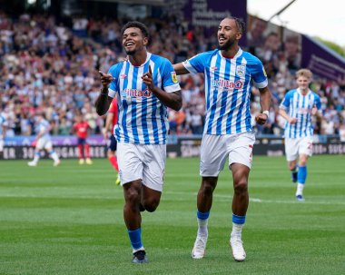 Tino Anjorin #8 of Huddersfield Town celebrates scoring his second goal to put the Terrirs 2-0 up