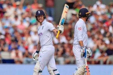 Ben Stokes of England raises his bat as he reaches fifty runs