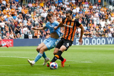 Jacob Greaves #4 of Hull City and Michael Rose #4 of Coventry City 