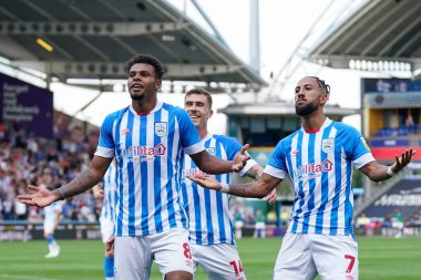 Tino Anjorin #8 of Huddersfield Town celebrates scoring with Sorba Thomas 