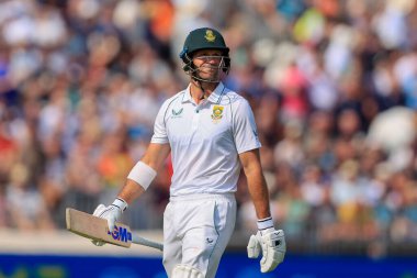 Sarel Erwee of South Africa is out for 25 runs and walks back to the pavilion