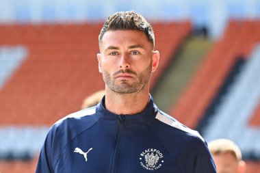 Gary Madine #14 of Blackpool arrives at Bloomfield Road