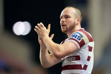 Liam Marshall #5 of Wigan Warriors salutes the fans after the match