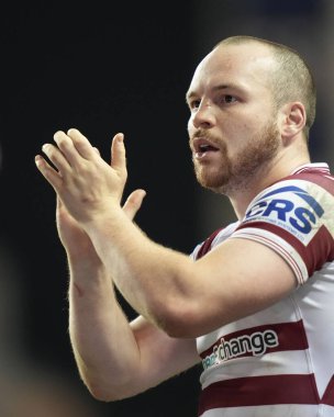 Liam Marshall #5 of Wigan Warriors salutes the fans after the game