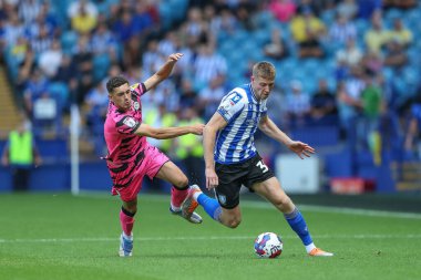 Mark McGuinness #34 of Sheffield Wednesday gets past Corey O'Keeffe #2 of Forest Green Rovers