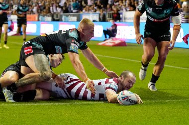 Liam Marshall #5 of Wigan Warriors touches down to score a try to take the score to 22-8 to the Warriors