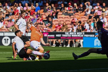 Shayne Lavery #19 of Blackpool is tackled by Zak Vyner (26) of Bristol City