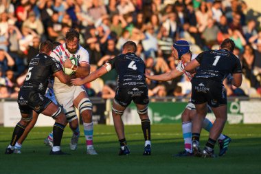Morgan Eames of Bristol Bears takes on Sean Lonsdale of Dragons Rugby,  and Huw Taylor of Dragons Rugby, 