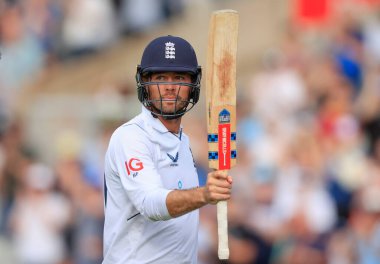 Ben Foakes of England raises his bat as the England innings concludes with a declaration with Foakes on 113 not out