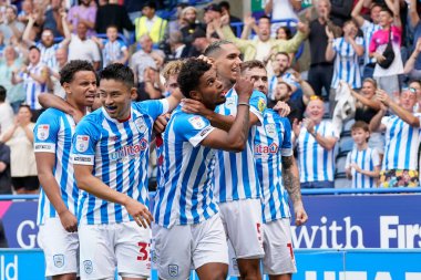 Tino Anjorin #8 of Huddersfield Town celebrates with this team mates after scoring his sides opening goal to go 1-0 up early in the first half