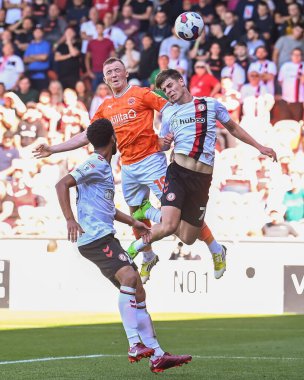 Shayne Lavery #19 of Blackpool wins the header on goal