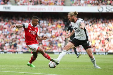 Gabriel Jesus #9 of Arsenal runs at Tim Ream #13 of Fulham 