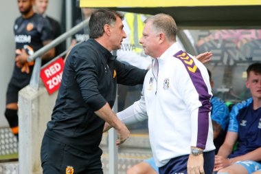 Shota Arveladze manager of Hull City and Mark Robins manager of Coventry City shake hands