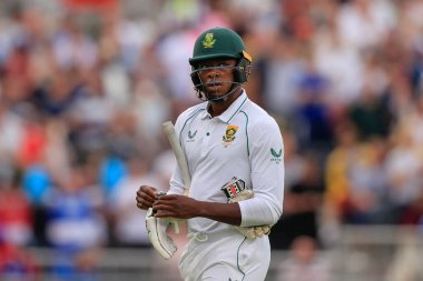 Kagiso Rabada of South Africa walks back to the pavilion as he is bowled out by James Anderson of England for 2 runs