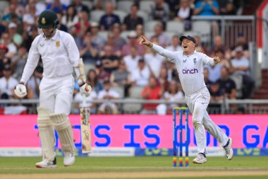 Ollie Pope of England celebrates the fall of the wicket of Anrich Nortje of South Africa 
